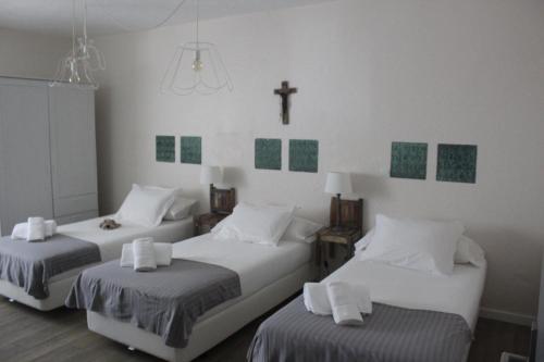 Postel nebo postele na pokoji v ubytování Quintinha do Poceirão