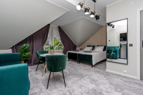 a bedroom with a bed and a table and chairs at SETO MAN Puhkekeskus in Värska