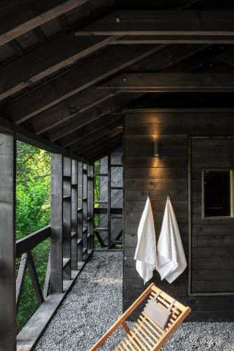 a room with white towels hanging on a wall at Hutstuf - The Fox & Private Outdoor Spa in La Roche-en-Ardenne
