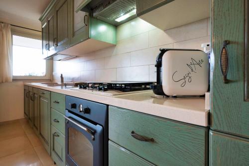 a kitchen with a appliance sitting on the counter at Atticus Apartment in Giardini Naxos