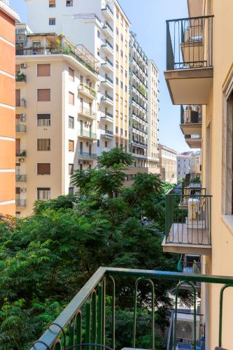 a balcony in a city with tall buildings at Partenope Guest House in Naples