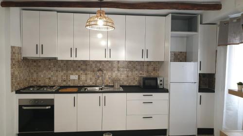 Kuchyň nebo kuchyňský kout v ubytování Casa de la Hoz