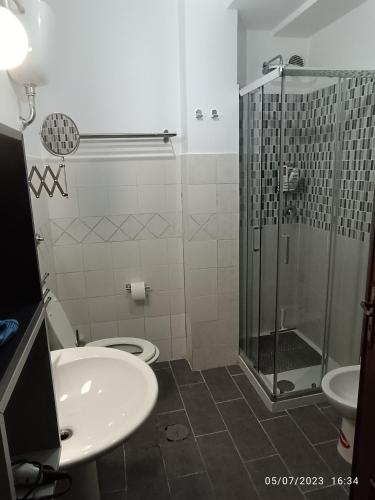 a bathroom with a shower and a toilet and a sink at Casa Coppola in Santa Maria La Carità