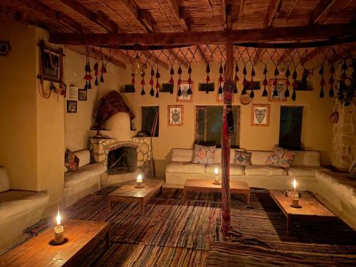 a living room with a couch and a fireplace at Moon_Valley_Siwa in Siwa
