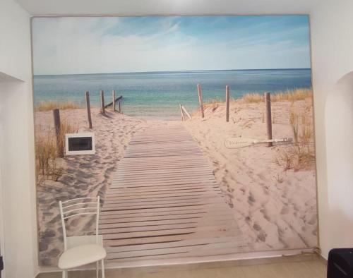a painting of a boardwalk to the beach at La Coccinella in Nettuno