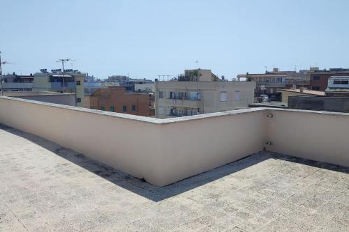 a white railing on top of a roof at La Coccinella in Nettuno
