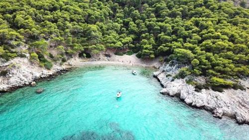 an aerial view of a beach with turquoise water at Salamis Luxury Escape in Salamina