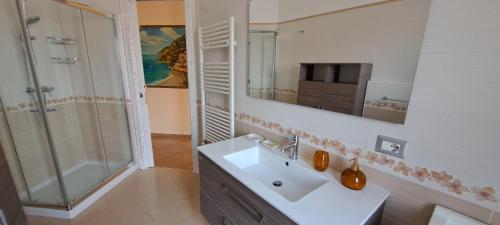 a bathroom with a sink and a shower at B&b Springs of Gods in Pianillo