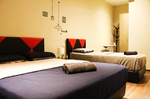 two beds in a room with two at D'CASA Riverson at Kota Kinabalu in Kota Kinabalu