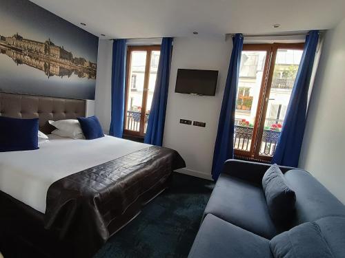 Ένα ή περισσότερα κρεβάτια σε δωμάτιο στο Hotel Aida Marais