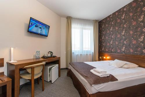 Ένα ή περισσότερα κρεβάτια σε δωμάτιο στο Hotel Esperanto
