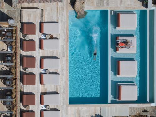 an overhead view of a swimming pool in a resort at Nimbus My Aktis in Super Paradise Beach