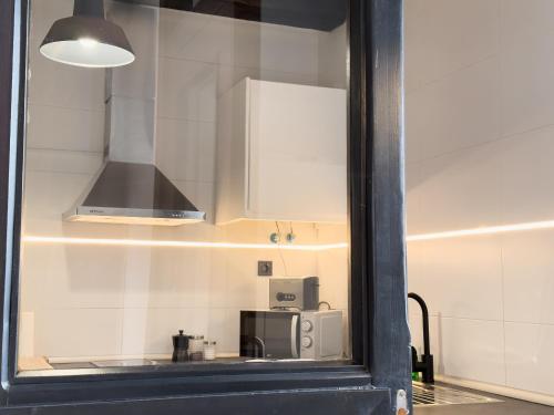 Kuchyň nebo kuchyňský kout v ubytování Estudio loft moderno muy céntrico