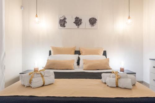 a bedroom with two beds with white sheets and two candles at [The historical center of Palermo] La Dolce Vita in Palermo