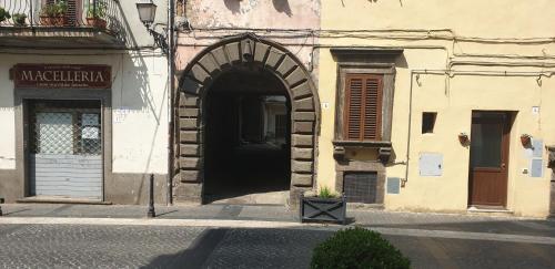 an entrance to a building with an archway at IL GIARDINETTO di Dilyana in Monterosi