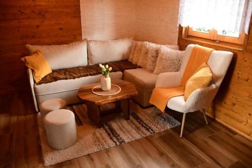 a living room with a couch and two chairs and a table at Milošev Konak in Malo Središte