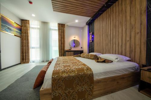 a bedroom with a large bed in a room at Air Barbaros Hotel Trabzon in Trabzon