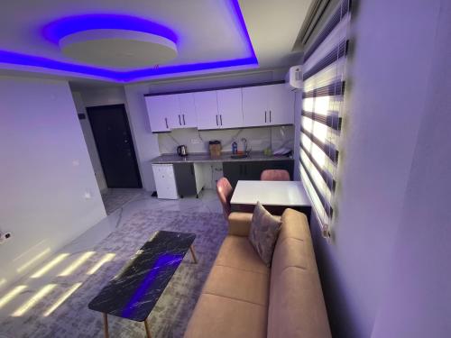 a living room with a couch and a table at Fatih apart otel in Bostancı