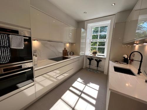 A kitchen or kitchenette at Principal Apartments - Crown Circus Duplex Apartment