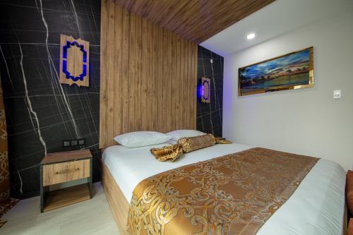 a bedroom with a bed in a room at Air Barbaros Hotel Trabzon in Trabzon
