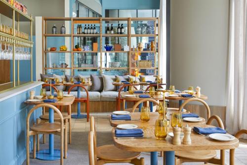 a restaurant with tables and chairs and a couch at The Westin Brisbane in Brisbane