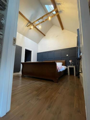 a large room with a bed in the middle of it at Glenogue Farm in Gorey