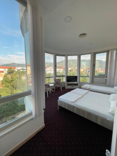 Postel nebo postele na pokoji v ubytování Lux Apartments
