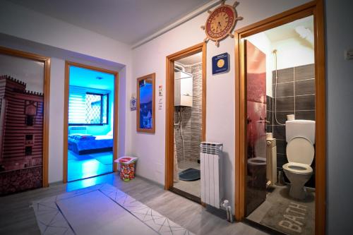 a bathroom with a toilet and a walk in shower at Marko Polo Apartment in Sarajevo