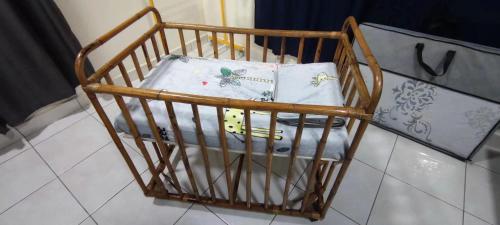 Кровать или кровати в номере S99 HOMESTAY KUDAT