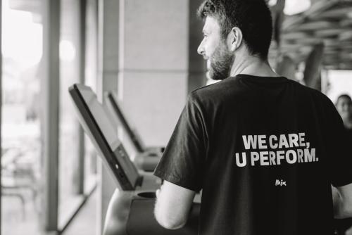 a man walking on a treadmill in a gym at Mix Brussels --Gym & Wellness for adults only-- in Brussels