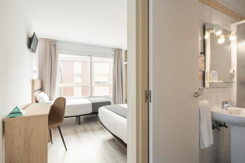 Ένα ή περισσότερα κρεβάτια σε δωμάτιο στο Hotel Alda Camiño Inglés