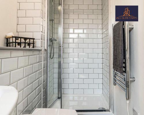 a white bathroom with a shower and a toilet at Swan House Apartment 5 - 2 Bed Apartment - Sleeps 6 - Free Parking - Liverpool - close to city centre - By ALL ELITE STAYS in Liverpool