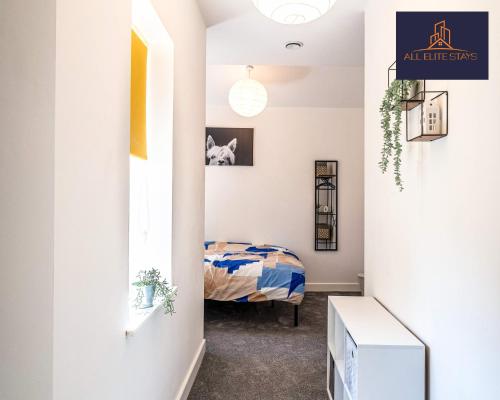 a bedroom with a bed in a room with a hallway at Swan House Stunning 1 bed Apartment By ALL ELITE STAYS - near Liverpool city centre - Sleeps 4 - Free Parking in Liverpool