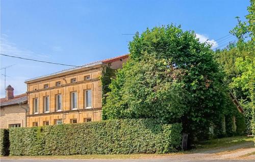 a large bush in front of a building at Pet Friendly Home In Boult-Aux-Bois in Boult-aux-Bois