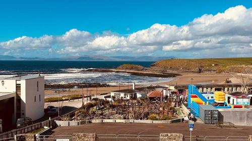 a view of a beach with a water slide at Bundoran Seaview Apartments in Bundoran