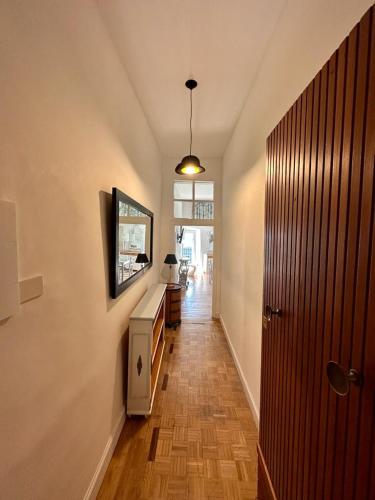 a hallway of a home with a wooden floor at Sibilla 21 Home in Tivoli