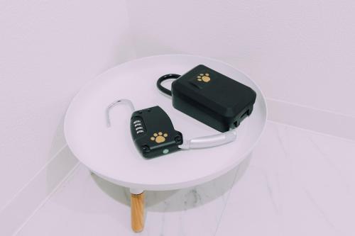 a electronic device sitting on top of a white table at moof Osaka trendy spot Spacious Apt in Osaka