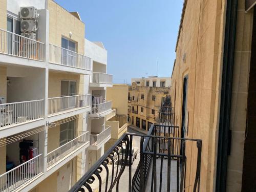 a view from a balcony of an apartment building at 2 Bedroom Apartment in Qala - Gozo in Qala