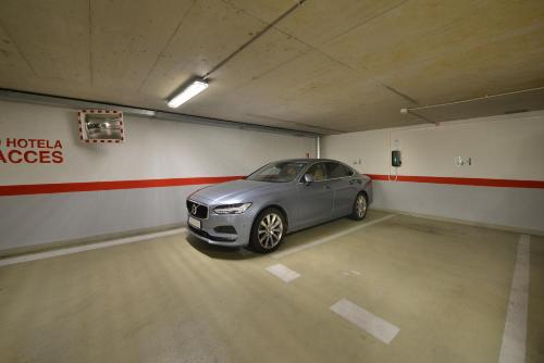 a car parked in a parking lot in a garage at Wilson Palace by LOFT in Bratislava