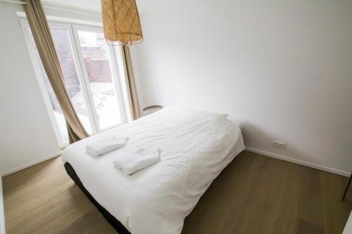 Postel nebo postele na pokoji v ubytování TravelEase - Midi