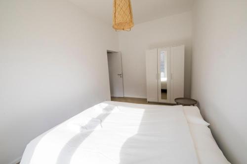 Postel nebo postele na pokoji v ubytování TravelEase - Midi
