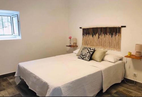 Tempat tidur dalam kamar di Casa 1-Quinta dos Penedos