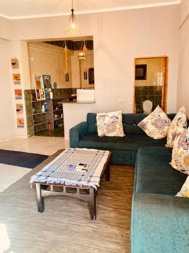 a living room with a couch and a coffee table at El-sheikh Salem villa in Dahab