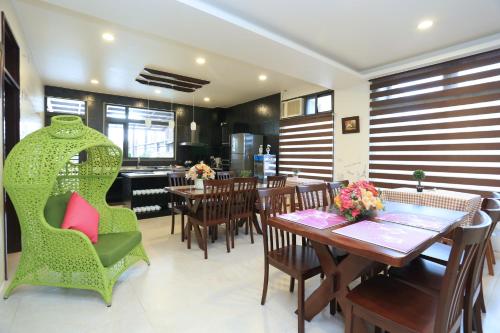 a dining room with a table and chairs at Flower B & B in Dongshan