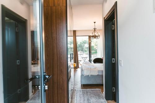 a room with a bedroom with a bed and a door at CAROLEA VILLAS in Ulcinj
