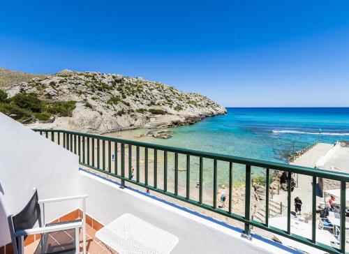 a balcony with a view of the ocean at Hoposa Niu in Cala de Sant Vicent