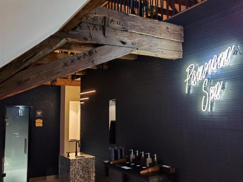 a wine tasting room with a wooden beam on the wall at Hotel Münchner Hof in Altötting