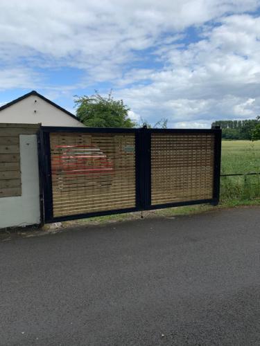 a large gate in front of a building at Newbus Grange Lodge The Cottage in Darlington