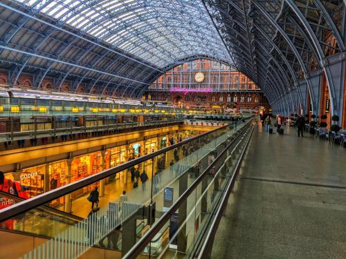 a view of a train station with a glass ceiling at Penthouse with Balcony in Luton