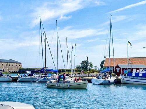 a group of boats are docked in a harbor at 4 person holiday home in Drottningskär-By Traum in Drottningskär